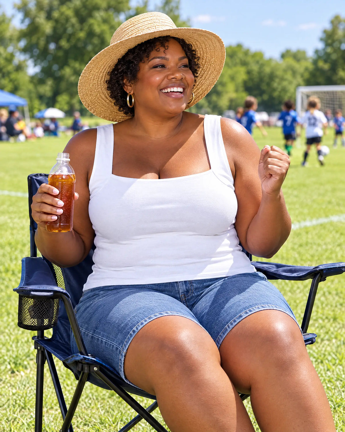 The same woman at the game in the White SmartFit tank: cool and cheering