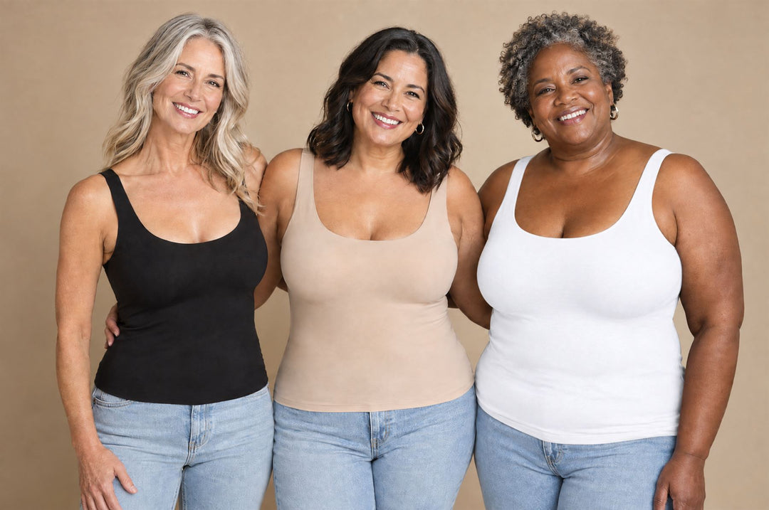 Three women of different sizes and ages wearing tanks in black, nude and white